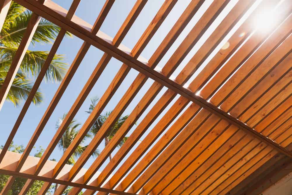 Wooden Sunshade Roof Structure Under Blue Sky At Sunny Summer