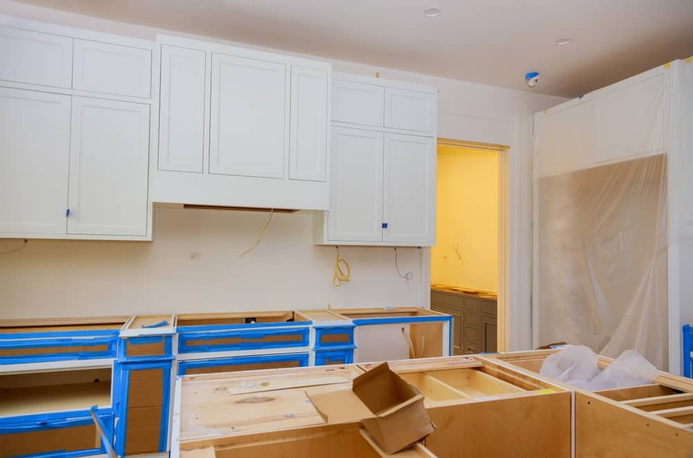 Installation Of White Kitchen Cabinets Furniture Interior With Newly Constructed